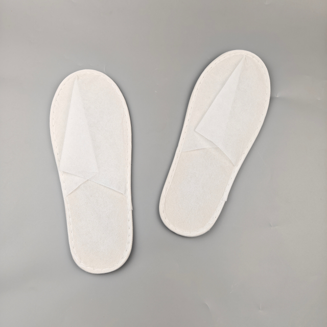 Economical Eco Friendly Disposable Nonwoven Hotel Room And Bathroom Slippers for Bulk Hotel Supplies